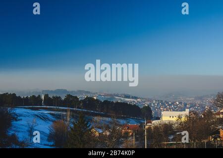 Air pollution above the city in winter Stock Photo