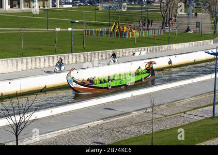 AVEIRO, PORTUGAL - Feb 19, 2020: Tourist tour on traditional Moliceiro boat in Aveiro, Portugal, Europe Stock Photo