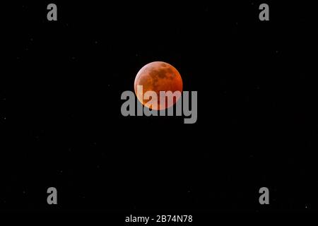 Super Blood Moon With A Dark Orange Color Stock Photo