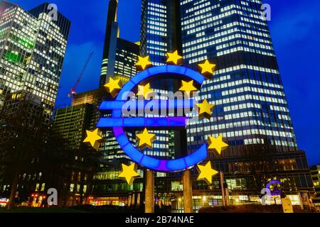 Frankfurt am Main, Germany - January 08, 2019: Euro sculpture in front of the Eurotower. It is a neon sign, designed bei Ottmar Hoerl Stock Photo