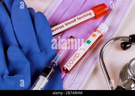 COVID-19 from China the virus causes atypical pneumonia complete blood count test tubes Stock Photo