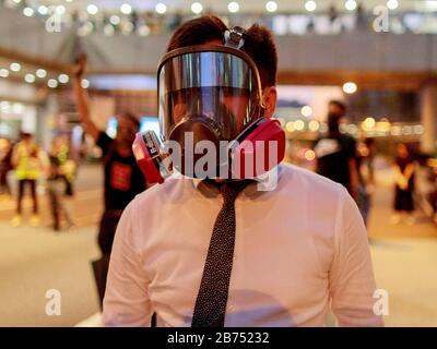 Hongkongers protest on the street after the govenment issues an anti-mask law today. Stock Photo