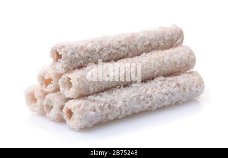 Stack of coconut wafer rolls isolated on white Stock Photo