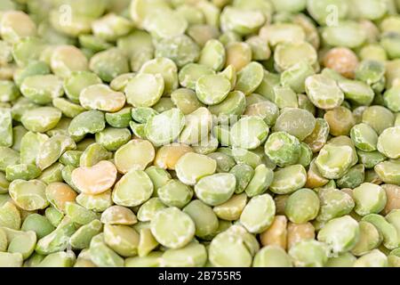 Dry split light green peas texture background Stock Photo
