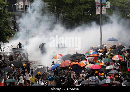 Police clash with protesters in Hong Kong. Stock Photo
