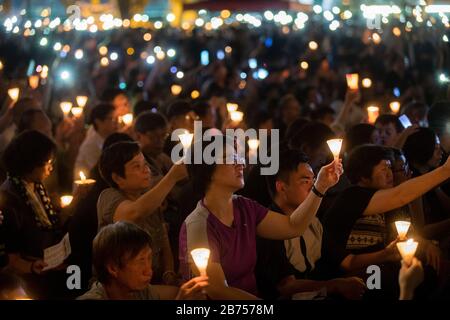 Participants attend the annual candlelit vigil commemorating the 30th anniversary of the 1989 Beijing Tiananmen Square massacre at Victoria Park In Hong Kong, China, 4 June 2019. Stock Photo