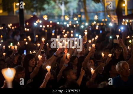 Participants attend the annual candlelit vigil commemorating the 30th anniversary of the 1989 Beijing Tiananmen Square massacre at Victoria Park In Hong Kong, China, 4 June 2019. Stock Photo