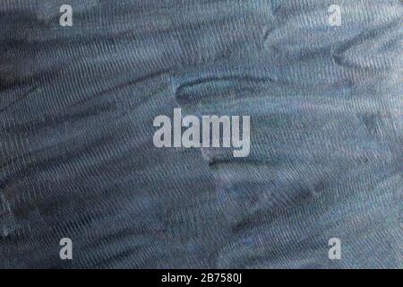 Close-up texture of flat steel surface manually cleaned with a flap wheel angle grinder. Stock Photo