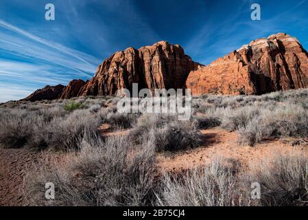 Snow Canyon State Park with its beautiful red rock mountains and volcanic rock formations. Stock Photo