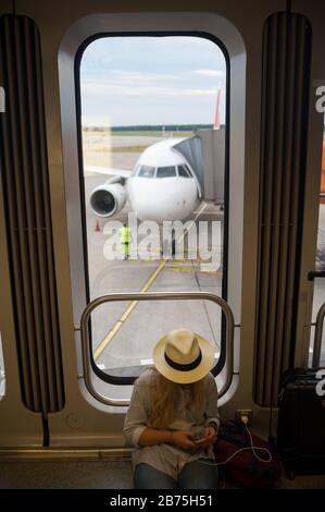 15.06.2017, Berlin, Germany, Europe - A Swiss passenger plane is parked at a gate at Berlin's Tegel airport while passengers wait for boarding. [automated translation] Stock Photo