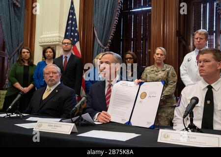 Texas, USA. 13th March, 2020. Texas Gov. Greg Abbott declares a 'state of disaster' in the state during a press conference at his Capitol office in Austin as Texas braces for an onslaught of coronavirus cases.Later in the day, Pres. Donald Trump declared a national emergency while the United States continues to battle spread of the virus. Credit: Bob Daemmrich/Alamy Live News Stock Photo