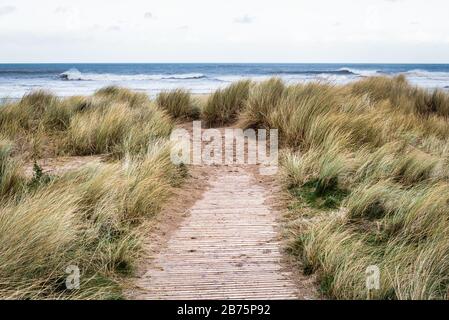 Wooden path that leads to Castlerock beach in Northern Ireland Stock Photo