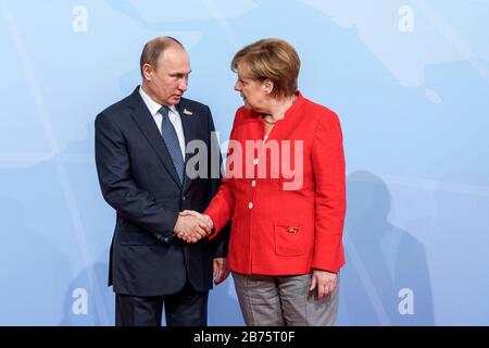 Germany, Hamburg, 07.07.2017. G-20 summit in Hamburg on 07.07.2017. Official welcome of the G-20 heads of state and government by the Federal Chancellor at the Hamburg Messe und Congress on 07.07.2017. Vladimir Putin (left), President of the Russian Federation and Dr. Angela Dorothea Merkel, Federal Chancellor. [automated translation]