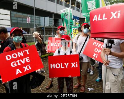 Protesters hold placards wrote with anti-Xi Jinping slogans during the annual pro-democracy rally in Hong Kong, China, 01 July 2017. Chinese President Xi Jinping inaugurated a new Hong Kong Chief Executive and marked the 20th anniversary of the city's handover from British to Chinese rule on 01 July. Stock Photo