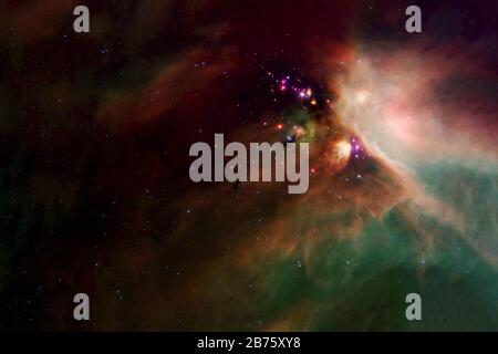 Space nebula in the red green. Elements of this image furnished by NASA were. Stock Photo