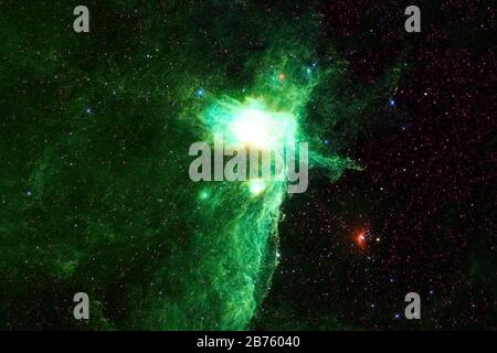 Beautiful space nebula of green color. Elements of this image were furnished by NASA. Stock Photo