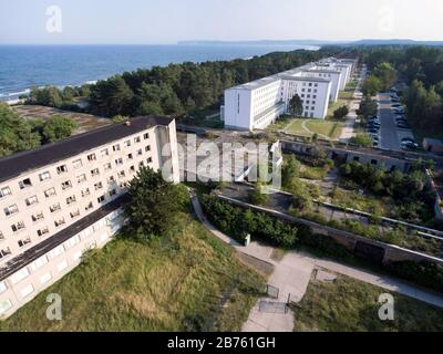 Aerial view of Prora, the four kilometre long seaside resort on 13.09.2016, which was built by the National Socialists almost 80 years ago. At that time 20,000 people were supposed to spend their holidays here. Under the name 'New Prora', luxury holiday apartments are now being built in the listed complex directly on the sea. The white buildings are already renovated. [automated translation] Stock Photo