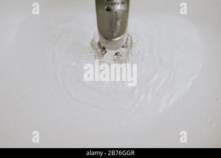 water flowing in sink making bubbles Stock Photo