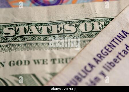 Macrophotography of an Argentine 100 pesos bill and one dollar (United States of Argentina) Stock Photo