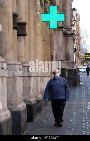 Coronavirus in Italy. Unidentified people wearing protective masks  Stock Photo