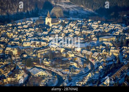 city centre of Winterberg with church St Jakobus Oversum Vital Resort at sunset, 28.12.2014, aerial view, Germany, North Rhine-Westphalia, Winterberg Stock Photo