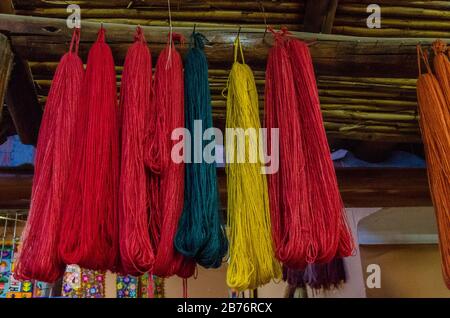 Sheep wool spun and dyed manually with natural dyes in Chincheros, Peru Stock Photo