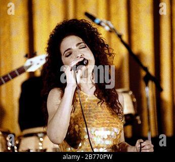 Washington, DC. USA, June 18, 1991 Gloria Estefan performs in the East Room of the White House as the evenings entertainment for the State Dinner honoring President Fernando Collor de Mello of Brazil.  Estefan, who was invited to perform for Collor because she can sing in Portuguese as well as English and Spanish-sometimes, it would seem, simultaneously. Credit: Mark Reinstein/MediaPunch Stock Photo