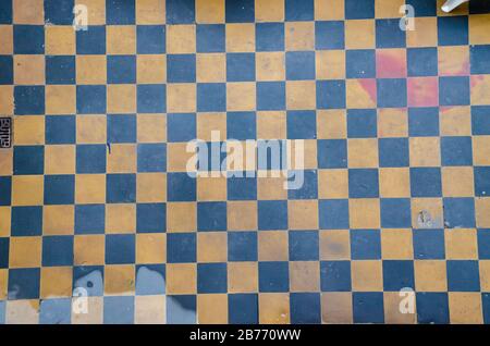 Yellow and Blue Checkered Floor Tiles, background, texture Stock Photo