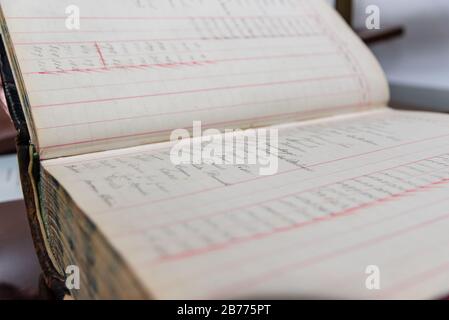 Antique handwritten accounting book of an old and inexistent business Stock Photo