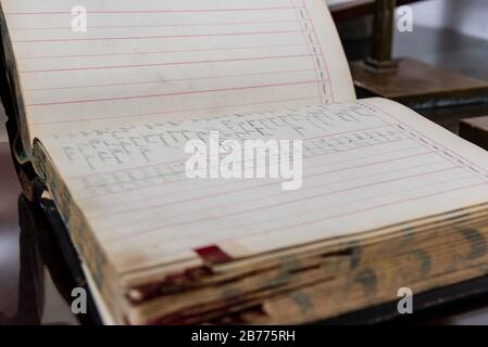 Antique handwritten accounting book of an old and inexistent business Stock Photo