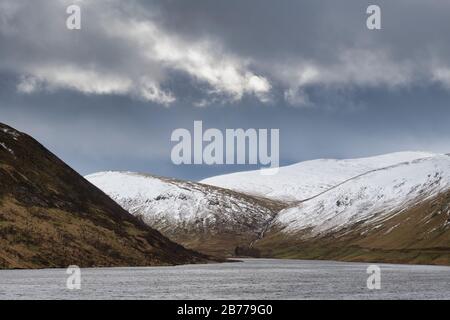 Stormy clouds over Megget reservoir and mountains in the winter. Megget Valley. Scottish borders. Scotland Stock Photo