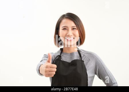 young attractive asian woman who cooks Stock Photo