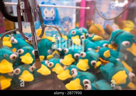 Close up view of claw vending machine commonly seen in Asian country Japan China Taiwan Stock Photo