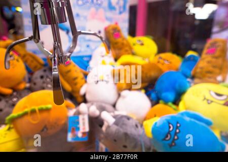 Close up view of claw vending machine commonly seen in Asian country Japan China Taiwan Stock Photo