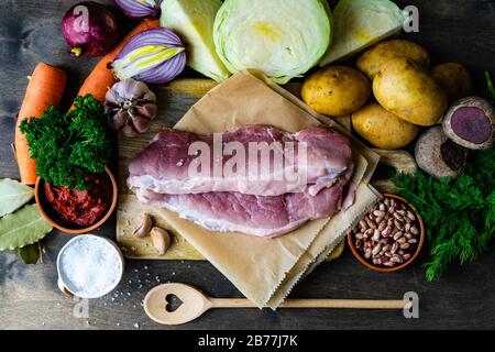 Borscht cooking concept with fresh ingredients on wooden table with copy space Stock Photo