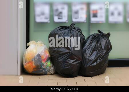 Three big blacks garbage bags full of trash Stock Photo - Alamy