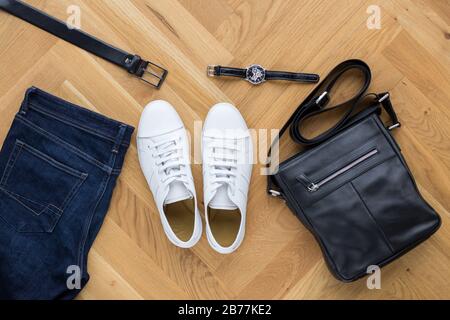 Overhead view Men trendy casual outfits on wooden background Stock Photo