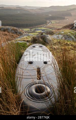 Walking in the Cairnsmore of Fleet National Nature Reserve, environment art work up on the Clints of Dromore, Rosnes Benches, Galloway, Scotland, UK Stock Photo