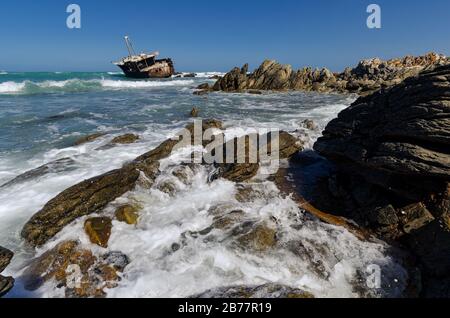 Meisho Maru No 38 Japanese fishing boat shipwrecked on rocky coastline of L'agulhas where Pacific and Atlantic oceans meet South Africa Stock Photo