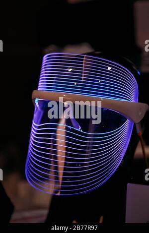 Mask in the futuristic cyberpunk style with neon light. Stock Photo