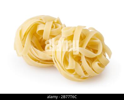 Uncooked nests of tagliatelle pasta isolated on white background with clipping path Stock Photo