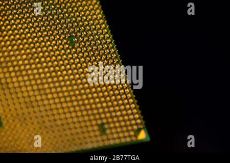 CPU pins. Central processor unit upside-down on a black background. Copy space. Stock Photo