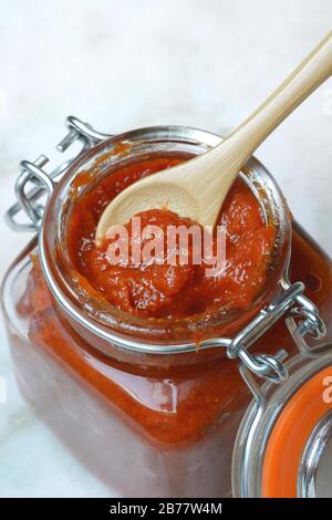 Red Thai curry paste in glass, Germany Stock Photo