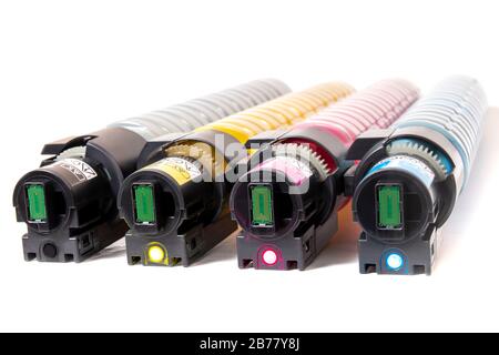 cartridges for laser printers aligned on a white background. Stock Photo