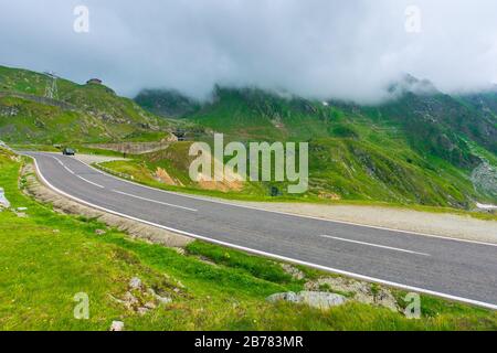 alpine road through mountain valley. epic view of transfagarasan route. popular travel destination. gorgeous landscape of fagaras mountains, romania. Stock Photo