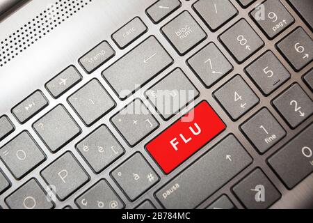 Red button on the computer with the text Flu Stock Photo