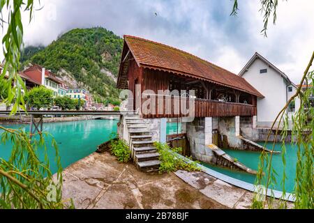 Panoramic view of weir on Aare river of Old City of Unterseen, Interlaken, important tourist center in the Bernese Highlands, Switzerland Stock Photo