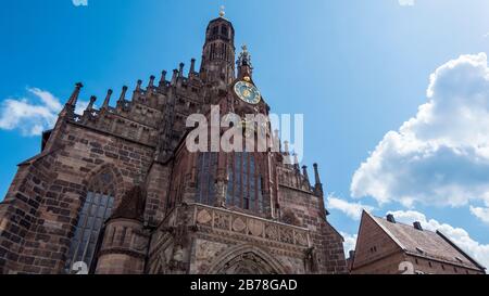 Nuremberg 2019.Frontal facade of the Frauenkirche. We are on a hot and cloudy summer day. August 2019 in Nuremberg Stock Photo