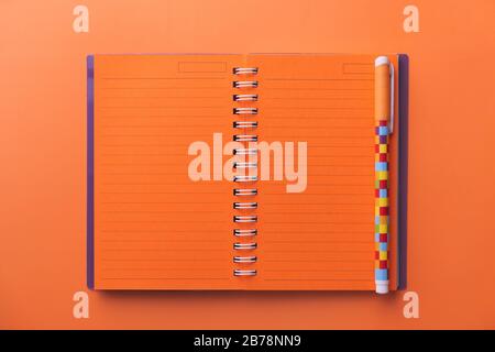 Wide view of blank spiral note pad and pen, to pview Stock Photo