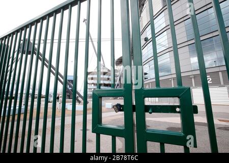 A view of locked gates outside the Etihad Stadium, home of Manchester City Football Club, following yesterday's announcement that the Premier League has suspended all matches until Saturday April 4, 2020. Stock Photo